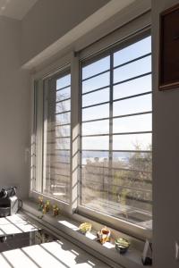 a window in a room with two windows with a view at Maestrale in Nebbiuno