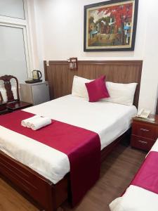 Postel nebo postele na pokoji v ubytování Hanoi Asia 2 Long Bien