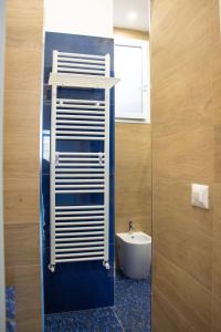 a bathroom with a white sink and a toilet at WANDERLUST Aria di Mare in Naples +93 photos