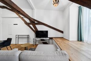 TV o dispositivi per l'intrattenimento presso GLANDON Rooms Haldenhof - Self-Check-In