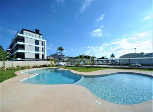 a large swimming pool in front of a building at ATICO BOHIO premium in Benicàssim