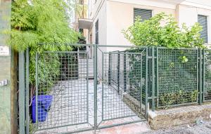 a gate in front of a building with plants at Lovely Apartment In Sestri Levante in Sestri Levante +17 photos