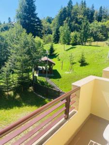 a balcony of a house with a gazebo at Ideal Predeal in Predeal