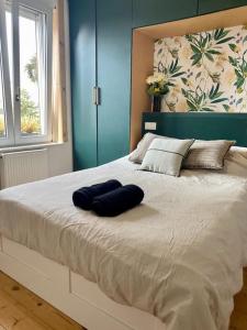 Postel nebo postele na pokoji v ubytování Maison 5min du vieux-Lille avec extérieur pour 1 à 6 personnes