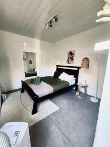 a bedroom with a bed in a room at Rear Garden Suite in Sydney