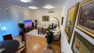 a living room with a couch and a chair at Top secret 24 in Belgrade