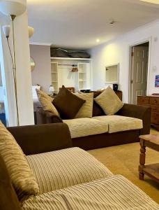 a living room with two couches and a couch at Tyacks Hotel in Camborne