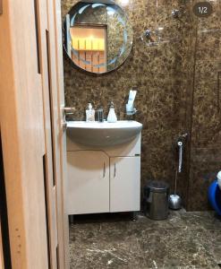 a bathroom with a sink and a mirror at Apartment in Dilijan in Dilijan