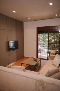 a living room with a couch and a table at Hotel Ehden in Ehden