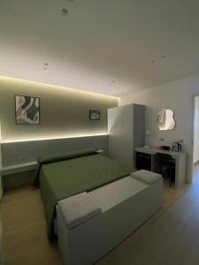 Postel nebo postele na pokoji v ubytování B&B IL Lux