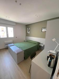 Postel nebo postele na pokoji v ubytování B&B IL Lux