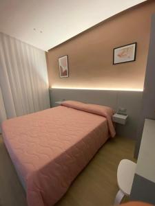 Postel nebo postele na pokoji v ubytování B&B IL Lux