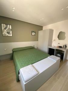 Postel nebo postele na pokoji v ubytování B&B IL Lux