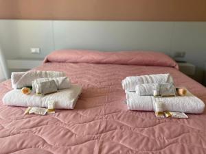 Postel nebo postele na pokoji v ubytování B&B IL Lux