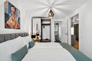 Letto o letti in una camera di GLANDON Rooms Haldenhof - Self-Check-In