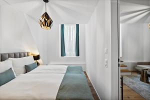 Letto o letti in una camera di GLANDON Rooms Haldenhof - Self-Check-In