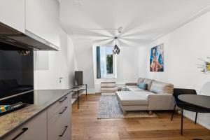 TV o dispositivi per l'intrattenimento presso GLANDON Rooms Haldenhof - Self-Check-In