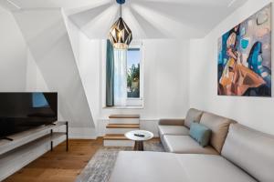 TV o dispositivi per l'intrattenimento presso GLANDON Rooms Haldenhof - Self-Check-In
