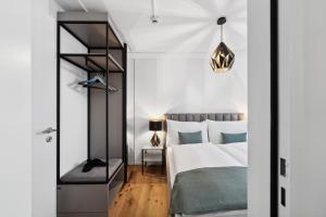 Letto o letti in una camera di GLANDON Rooms Haldenhof - Self-Check-In