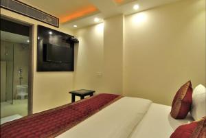 Postel nebo postele na pokoji v ubytování Hotel Sai Miracle - New Delhi