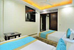 Postel nebo postele na pokoji v ubytování Hotel Sai Miracle - New Delhi