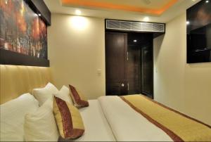 Postel nebo postele na pokoji v ubytování Hotel Sai Miracle - New Delhi