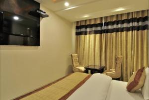 Postel nebo postele na pokoji v ubytování Hotel Sai Miracle - New Delhi