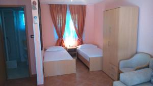 Postel nebo postele na pokoji v ubytování Apartments Rale