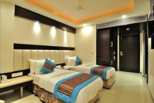 Postel nebo postele na pokoji v ubytování Hotel Sai Miracle - New Delhi