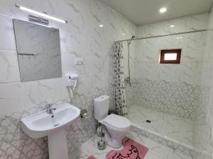 a bathroom with a sink and a toilet and a shower at Islam Khodja in Khiva +22 photos