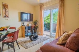 a living room with a couch and a table at La Dama in Novi Vinodolski