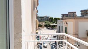 a balcony with a view of a street at Principe Boemondo Luxury Room in Canosa di Puglia