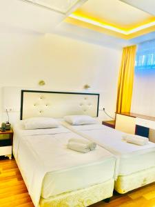Postel nebo postele na pokoji v ubytování Hotel Argo