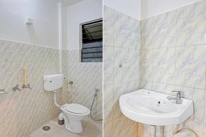 Koupelna v ubytování Hotel O Aru Sai