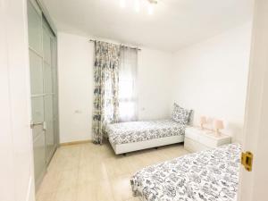 Postel nebo postele na pokoji v ubytování Ocean Front Teneriffa 2 Bedroom Penthouse Costa Adeje