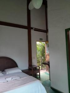 Postel nebo postele na pokoji v ubytování Pousada Canto Da Lua - Macacos