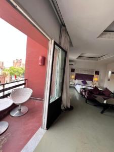 Postel nebo postele na pokoji v ubytování La Renaissance hôtel Marrakech