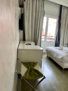 Postel nebo postele na pokoji v ubytování La Renaissance hôtel Marrakech