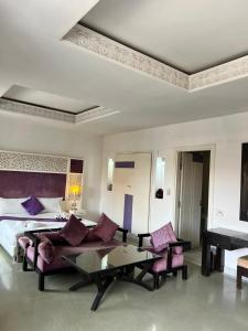 Postel nebo postele na pokoji v ubytování La Renaissance hôtel Marrakech