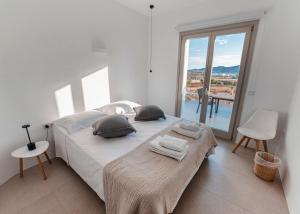 Postel nebo postele na pokoji v ubytování CAMPO SUITES