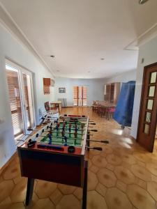 a room with a foosball table in the middle at Villa Verde in Ceccano
