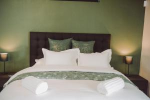 Postel nebo postele na pokoji v ubytování Welterusten Bij Kleine Schuur