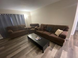 a living room with a couch and a coffee table at Private room. 5 mins from Freemont. 10 mins from strip in Las Vegas
