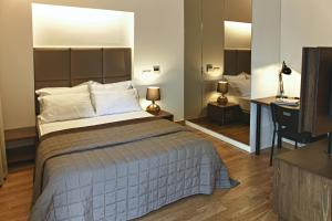 a hotel room with two beds and a television at Apartman Istanbul in Istanbul