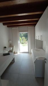 Postel nebo postele na pokoji v ubytování Agriturismo Casa Bregalda