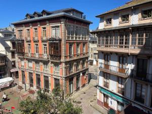 a group of tall buildings in a city at Marinera in Luarca
