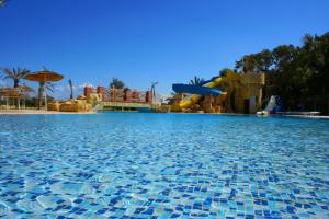 a large swimming pool with a water park at Marhaba Royal Salem - Family Only in Sousse