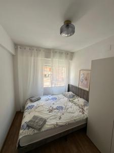 En eller flere senger på et rom på Seashell apartment in Cullera
