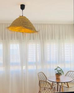 a table and chairs in front of a window at Sea City Torremolinos Beach in Torremolinos +8 photos