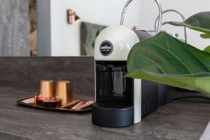 a coffee maker sitting on top of a counter at B&B Lofts Thassos in Skala Rachoniou